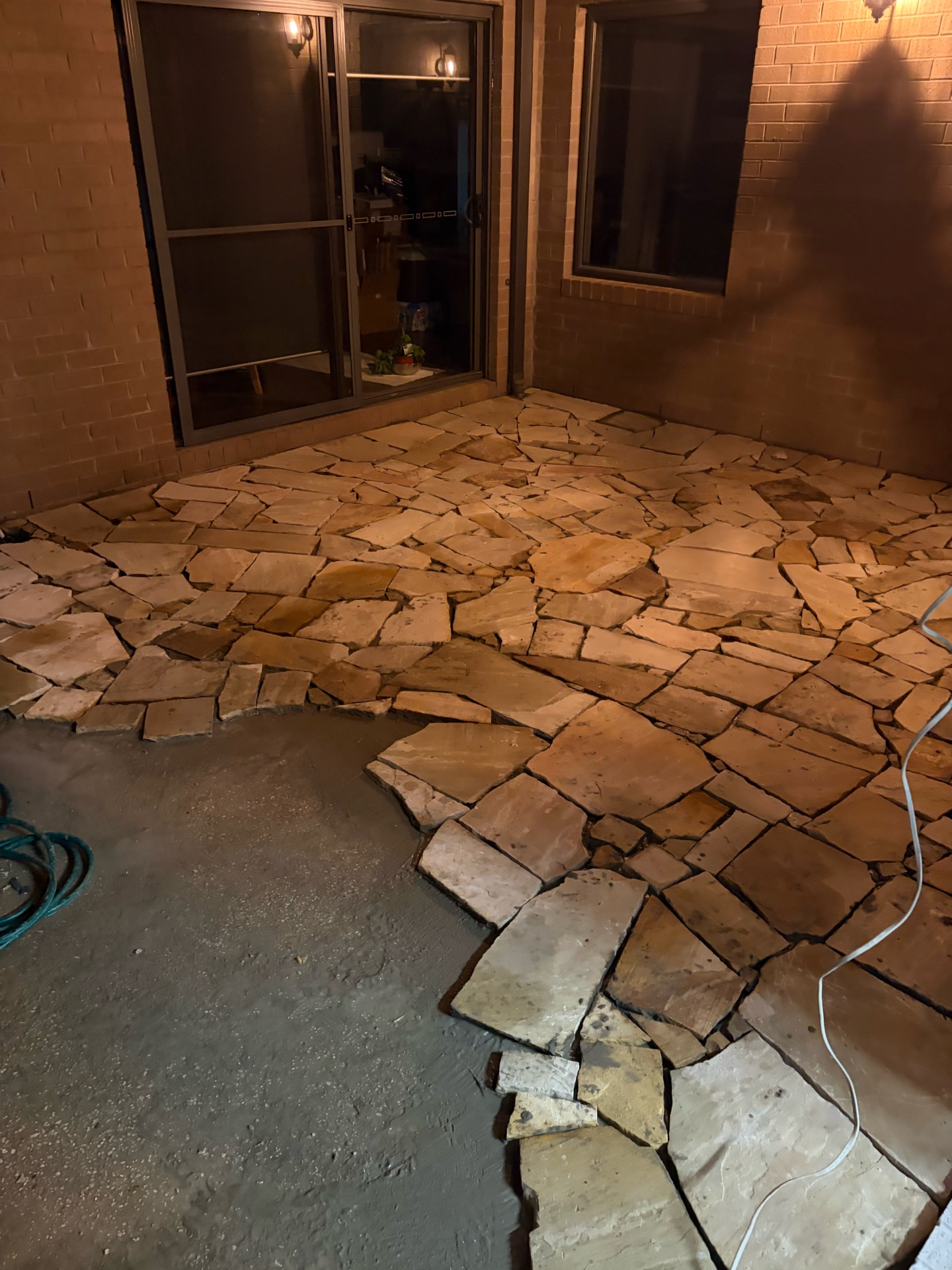 Crazy paving sandstone installation in progress, Melbourne outdoor renovation