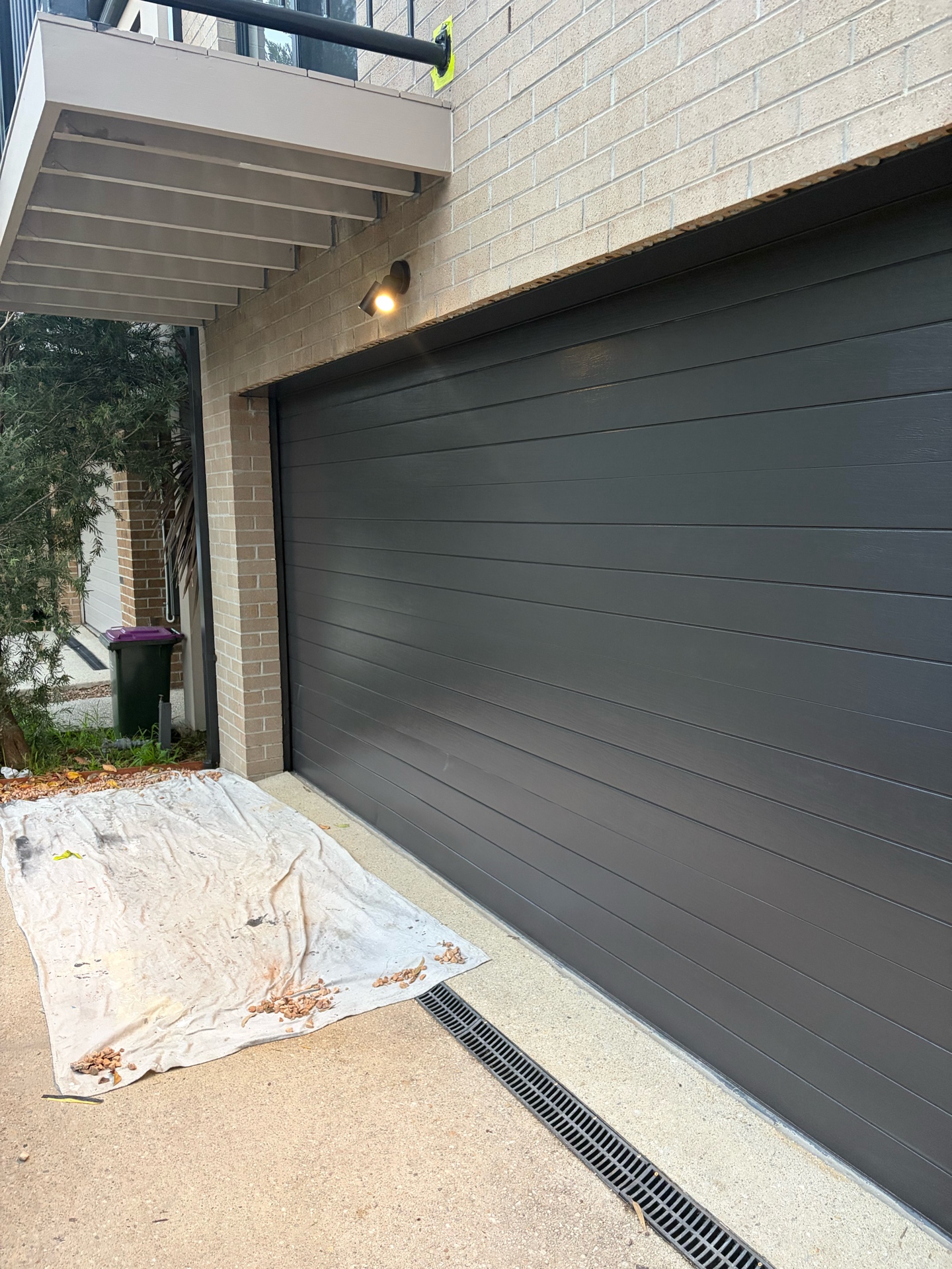 Freshly painted charcoal garage door on Melbourne home