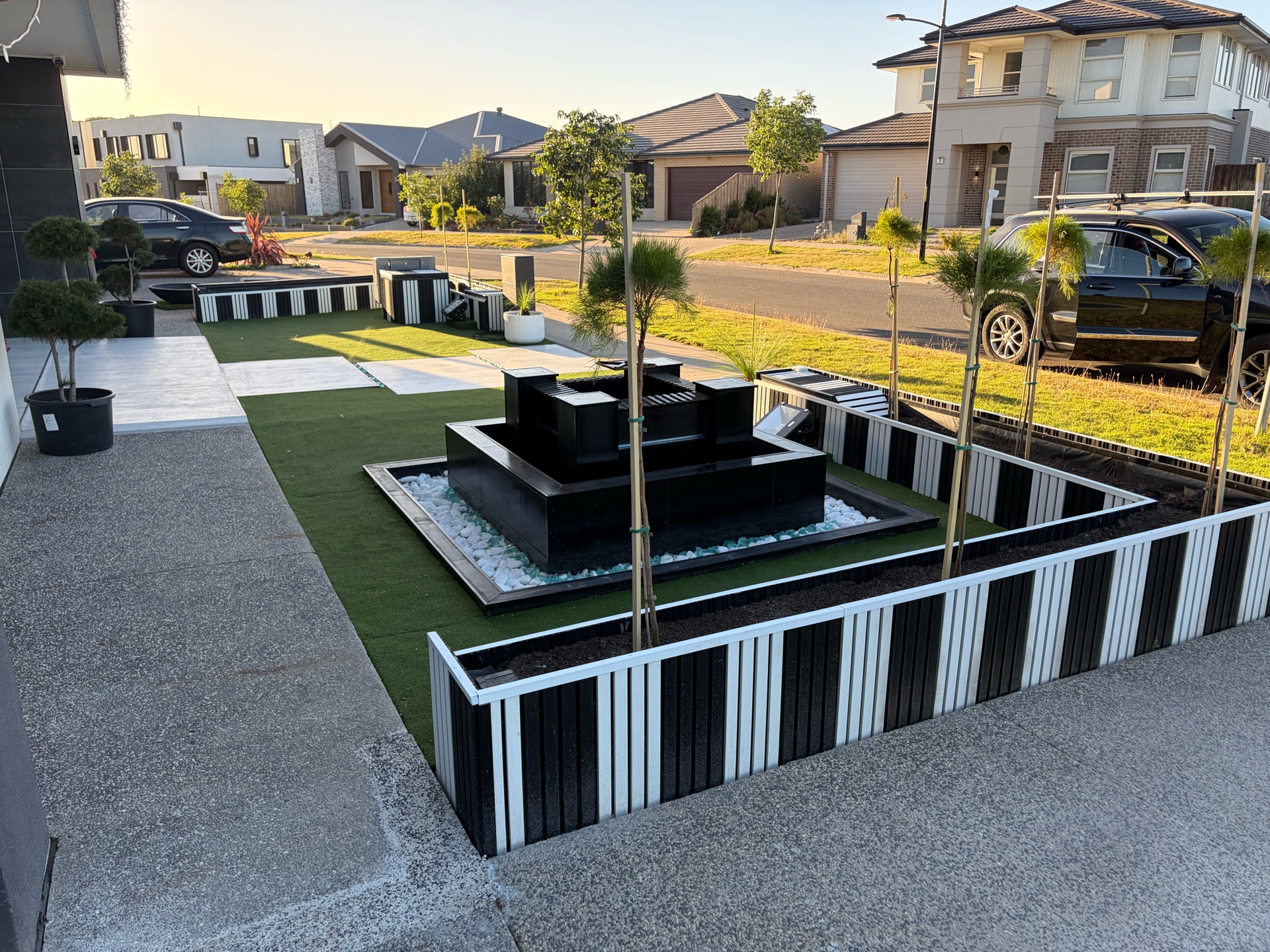 Custom landscaping with water feature fountain and artificial turf, Melbourne western suburbs