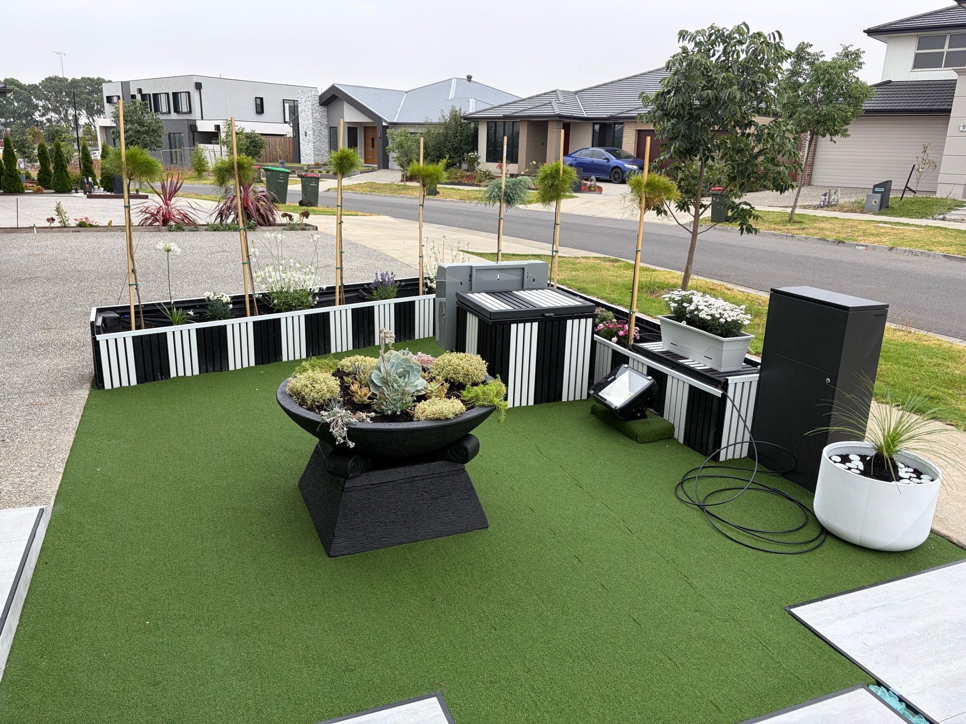 Custom garden beds with raised planters and artificial lawn, Melbourne